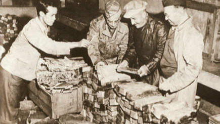 American soldiers inspect World War II looted treasure.